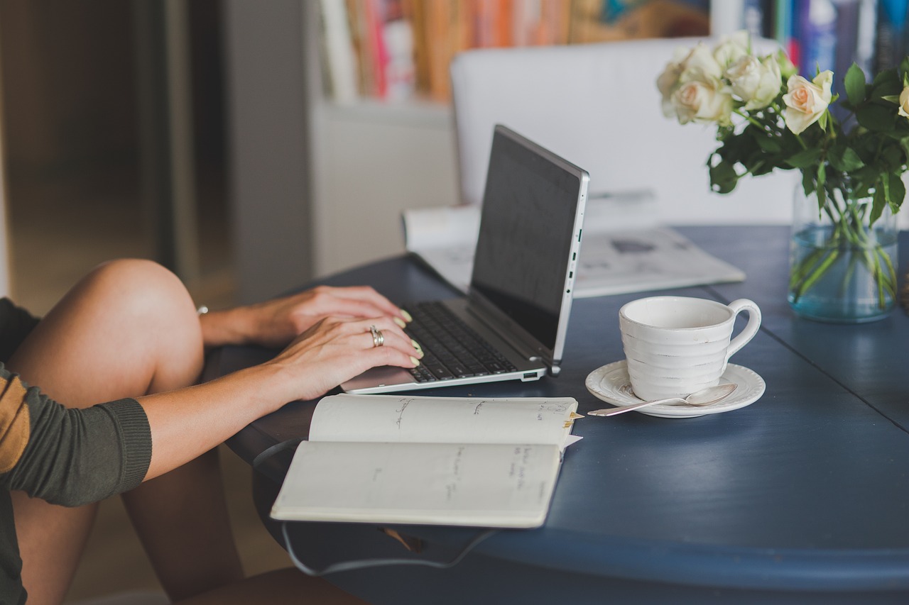 A woman sitting in front of a laptop