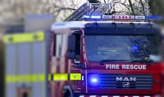 Firefighters tackle moorland car blaze