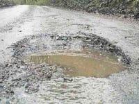 Road’s ‘bomb craters’ damaging cars daily