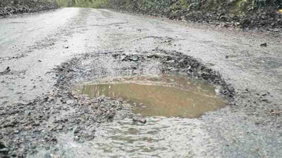 Road’s ‘bomb craters’ damaging cars daily