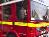 Trapped dog walker rescued from mud