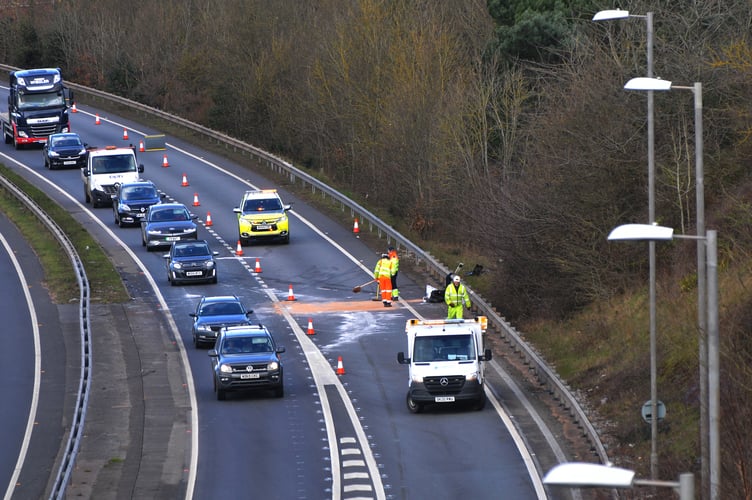 Photo: Steve Pope MDA040322A_SP001
Highways staff  clearing the A30 east-bound carriageway  following this morning’s collision between a tractor and a lorry