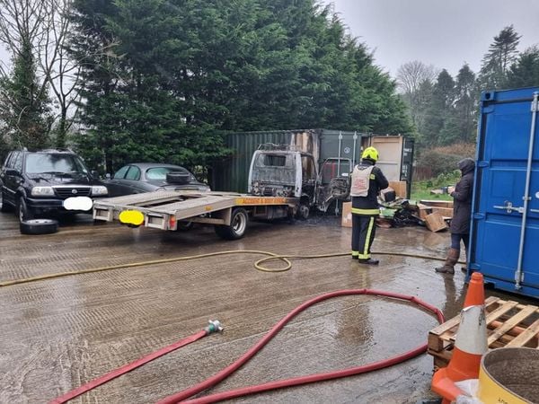 Flat bed vehicle destroyed by fire