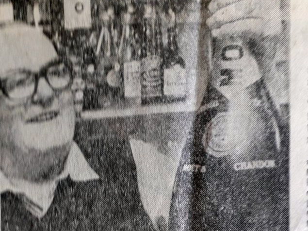 George Rowe with the champagne bottle given by a mystery donor.