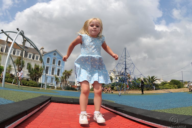Photo: Steve Pope MDA220722B_SP003
Children's playpark at The Den, Teignmouth, re-opens after refurbishment.  Jump to it  - three year old Eloise Primrose Clarke from Teignmouth