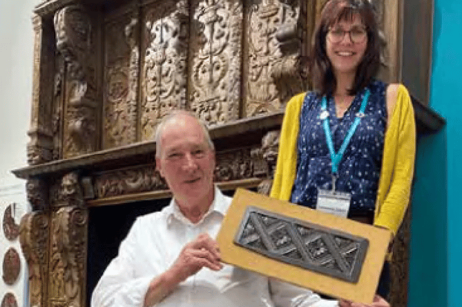 David Weeks and Dr Charlotte Dixon with the screen and its missing
section
