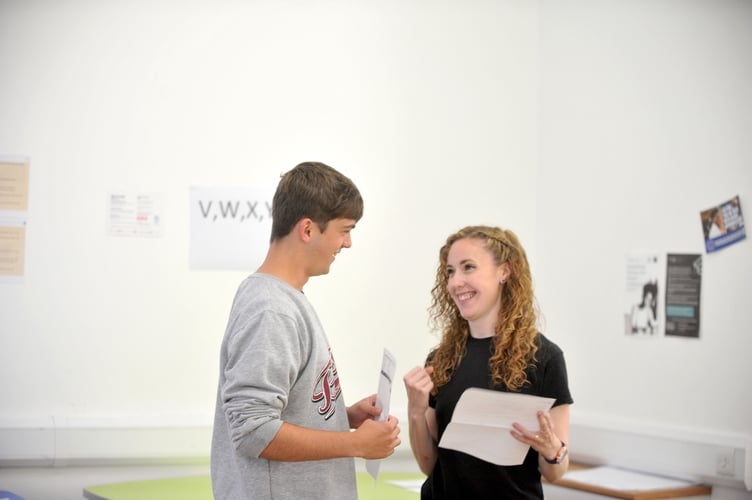 MDA180822C_SP004
A Level results. Coombeshead Academy. Year 12 student Thomas Taylor with teacher Beth Ousey. Thomas, from Newton Abbot, was extremely happy with his A grade for core maths and two distinctions in first year computer science