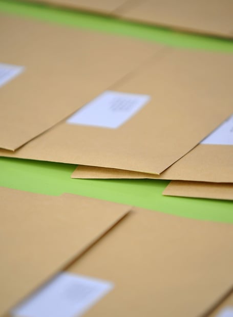 The all-important result-carrying brown envelopes.