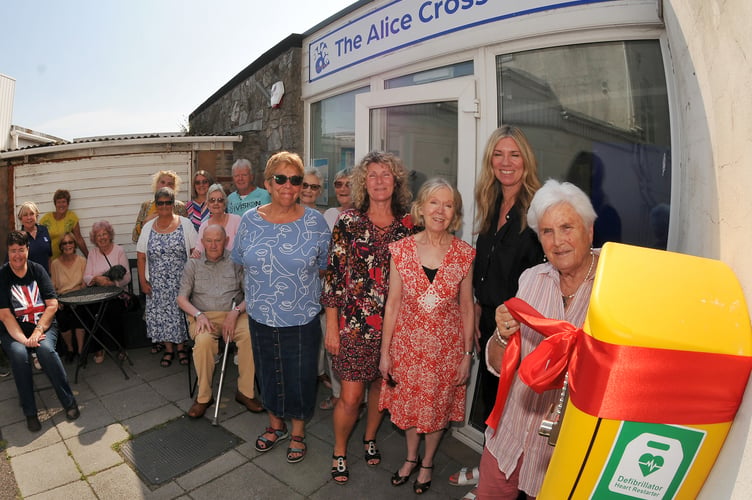 Defibrillator fitted at The Alice Cross Centre in Teignmouth is officially opened with Viv Wilson MBE