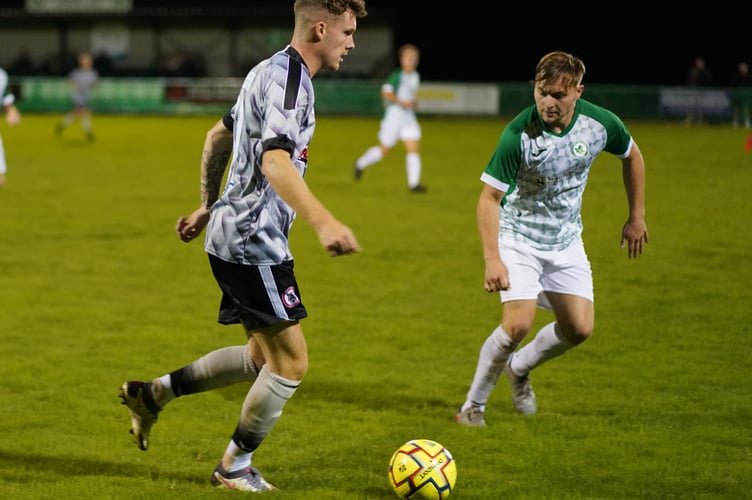 Mitch Thomas carries the ball along the wing as Bovey were looking to see out the game.