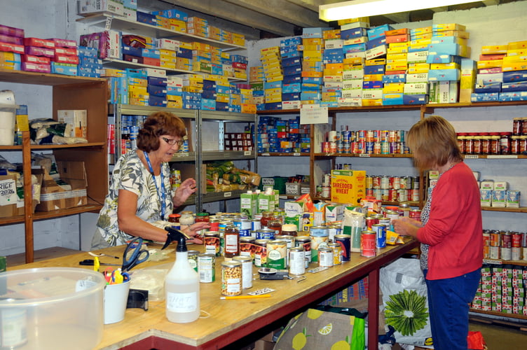 THAT volunteers, Silvia Pett and Jan Graham, processing donated goods