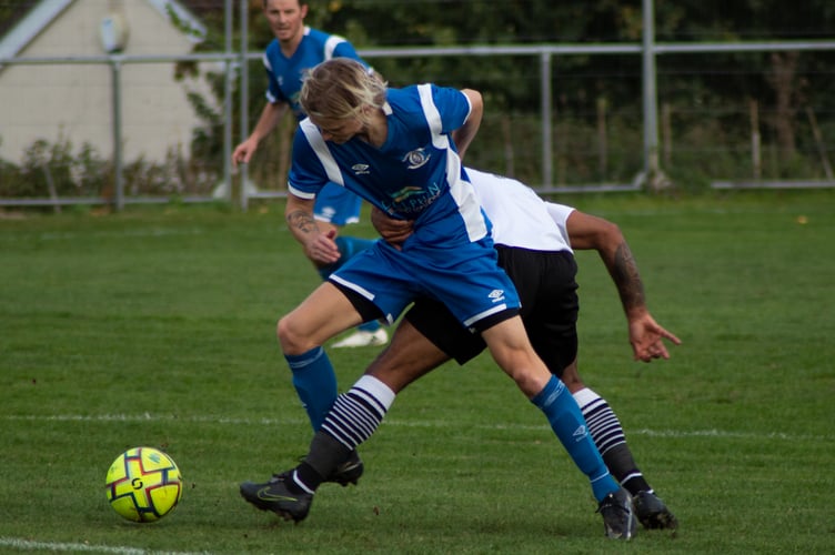 Kieran Knight (front) battles with Jay James in an incident which would later see the Teigns man sent off.