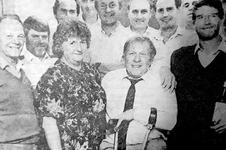 Despite the crutches, Barney managed a smile during a farewell social with colleagues.