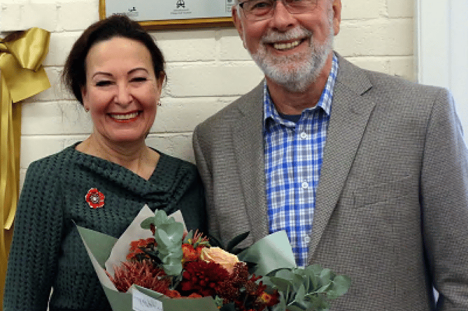 Trustees of Abbotskerswell Village Hall officially open the new kitchen and store extension with the help of local MP, Anne Marie Morris, who is pictured with chairman of the trustees, Barry Hedger