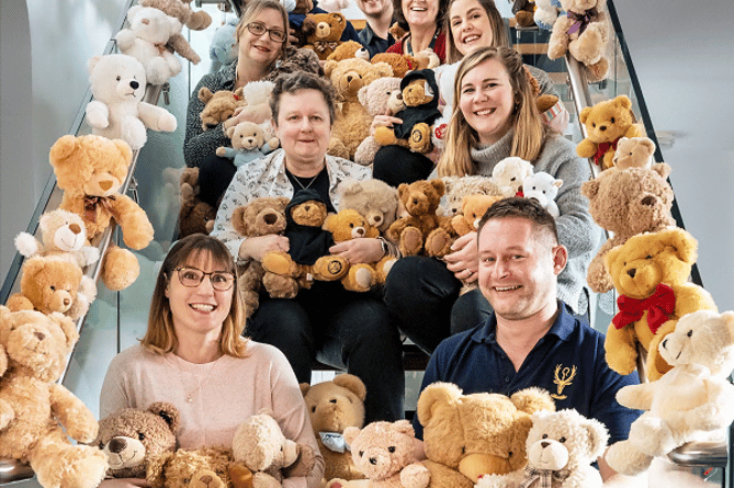Staff from Buckfast Abbey with the teddy bears 