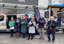 Dog owners and their four legged friends gather for carol service