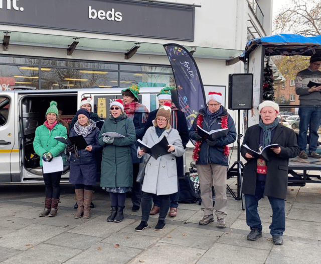 Dog owners and their four legged friends gather for carol service