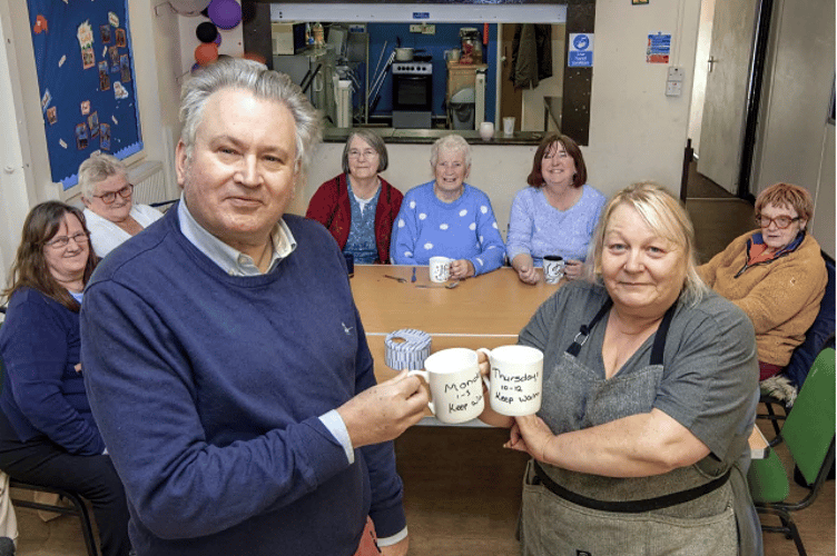 COSY CLUB: Cllr David Cox and Karen Ryding, KRA community worker, welcome people to the warm hub.
