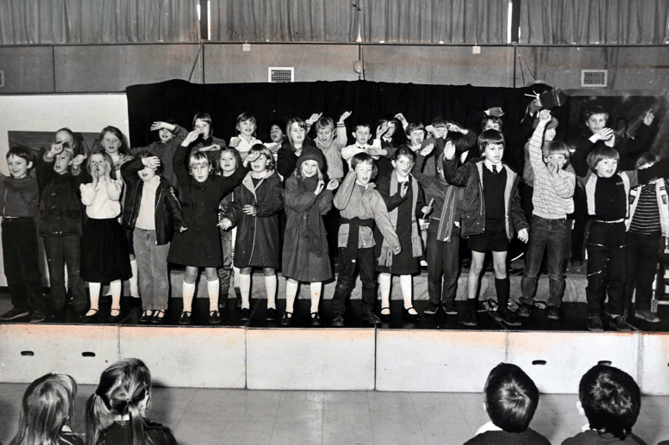 Youngsters taking part in Bishopsteignton Primary School’s Christmas production entitled Shopping in Woolies. Sadly that’s something we can’t do anymore!