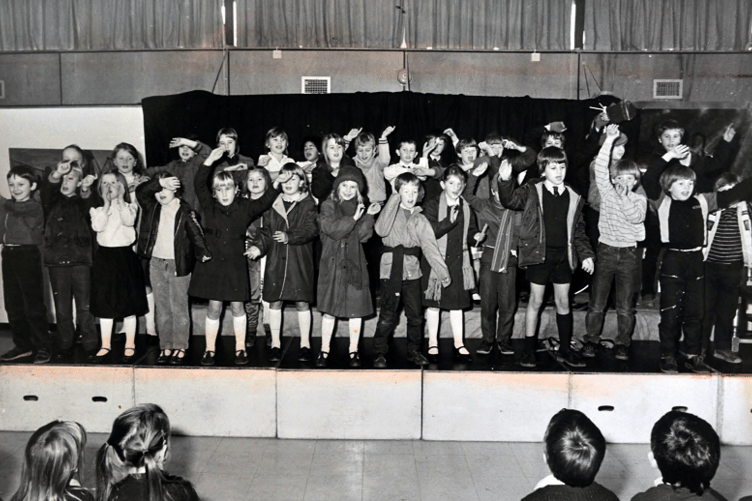 Youngsters taking part in Bishopsteignton Primary School’s Christmas production entitled Shopping in Woolies. Sadly that’s something we can’t do anymore!