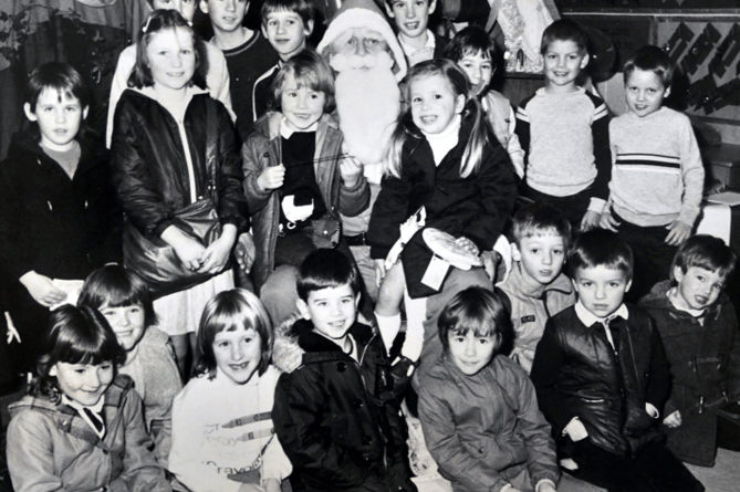 Father Christmas visits Dawlish Infants School  Christmas Fair in December 1984
