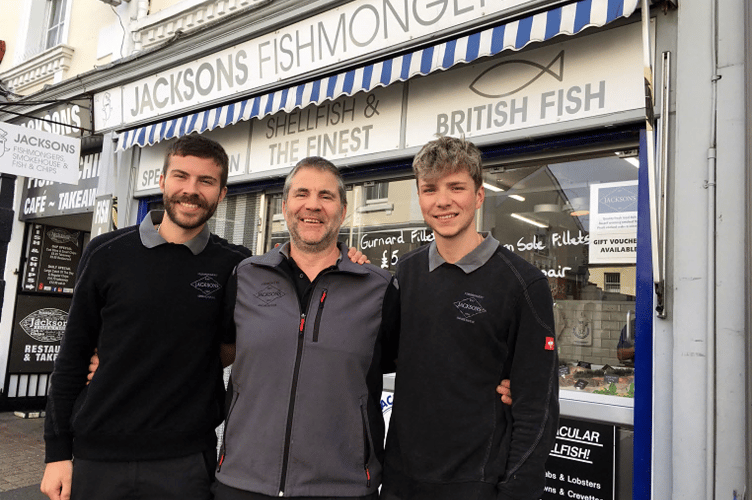 Celebrating a centenary as one of Newton Abbot’s most continuous
buinesses were Jacksons Fishmongers. Owner Matt Endacott is pictured
with sons Calvin, left, and Lewis.