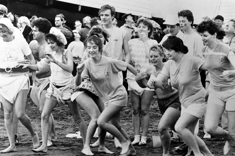 The sprint to the sea. Revellers taking part in the event on Boxing Day 1988