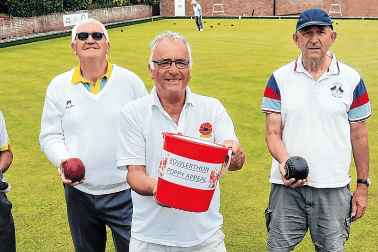 Birthday bowler Richard Hayward, with bucket, and fellow bowlers.
