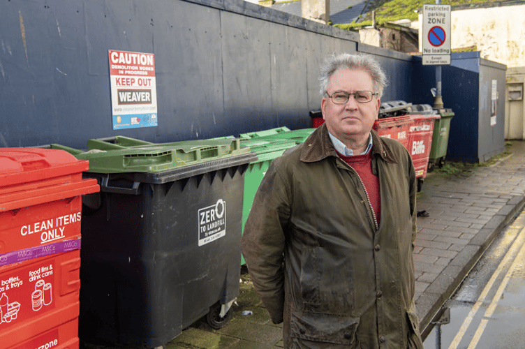 Cllr David Cox with some of the commercial bins.