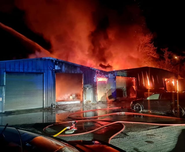 Firefighters battle flames at industrial units