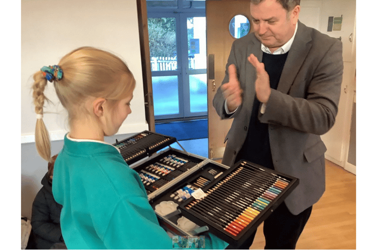 Nine-year-old pupil pupil Daria Viushynska had a pleasant surprise for MP Mel Strie when she presented him with a special drawing.