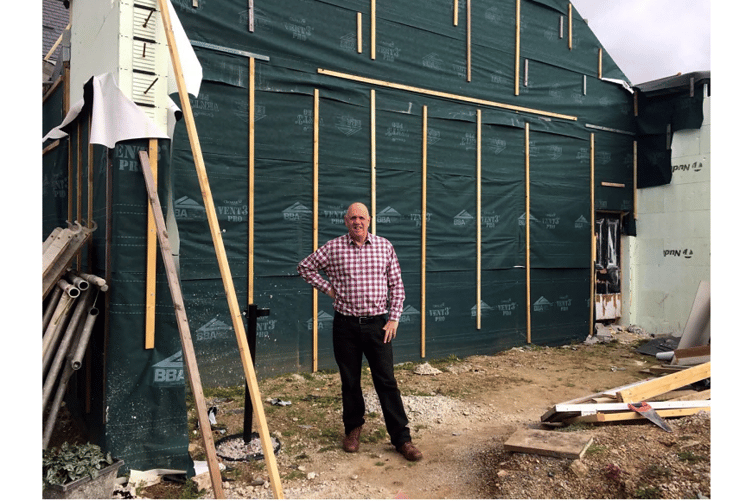 Andrew Huckerby and the old coaching house entrance which will eventually become the entrance to the dining complex.