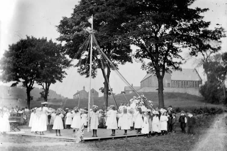 stock image of Maypole dancing
