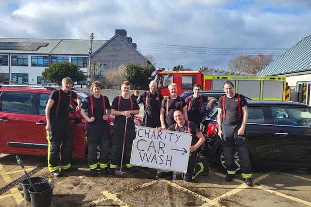 Firefighters raise more than £1,000 at charity wash