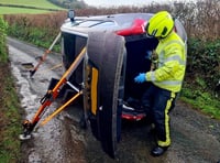Couple and a dog rescued from overturned car