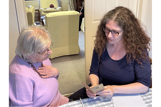 Cllr Alison Eden explains to 86-year old Mrs Jean Brand (née Russell) that she cannot use her World War 2 Identity Card at the Polling Station.