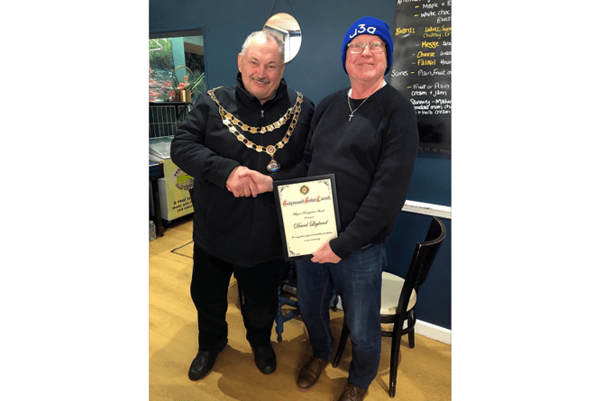 Teignmouth mayor, Cllr Iain Palmer, presents community champion, David Leyland, with his award