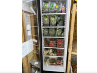 Supermarket champion Liz sees surplus food fill community fridge 