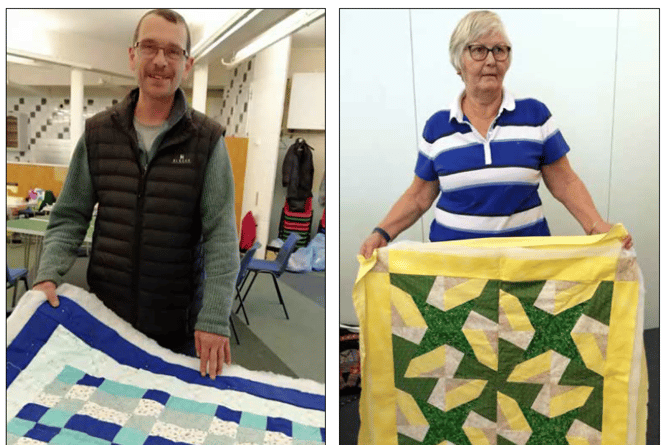 Mayor of Buckfastleigh, Cllr Huw Cox, left, congratulates members of the Patchwork Quilt Challenge.  Right, Becca with the quilt she made