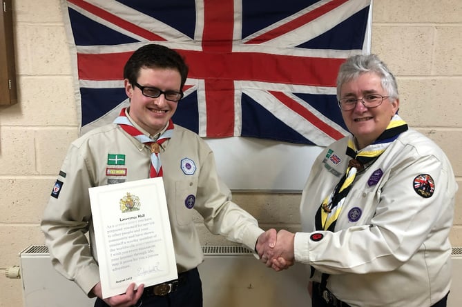 Lawrence Hall of 1st Bovey Tracey Scout Group was presented with the Queen’s Award by Teignbridge Scouts District Commissioner, Anne-Marie Sampson. 