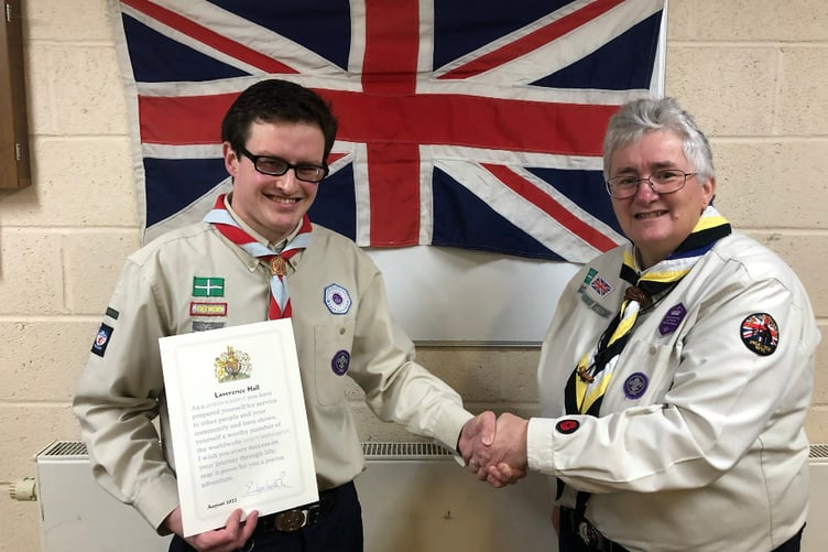 Lawrence Hall of 1st Bovey Tracey Scout Group was presented with the Queen’s Award by Teignbridge Scouts District Commissioner, Anne-Marie Sampson.