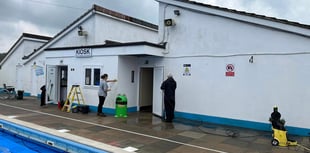 Volunteers see pool is spick and span ahead of Saturday's opening 