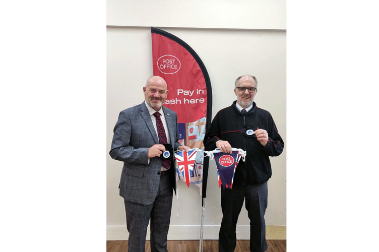 Ashburton Postmaster Stuart Rogers and Community Volunteer, Martin Brooks, put up street decorations and decorated the branch ready for the King’s Coronation.