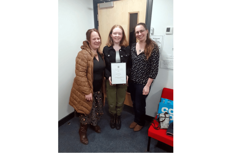 Jaz Saunders with her award and school staff members Alexandra Jones (left) and Maryanne Wills.