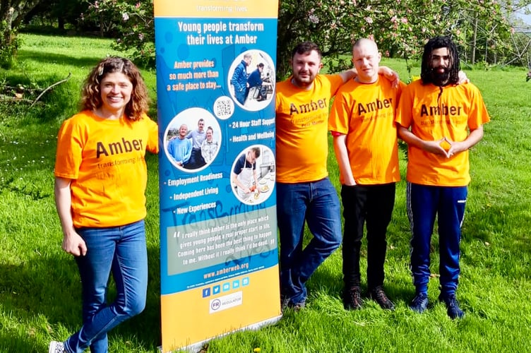 Becky Fry, Fundraising Manager along with three young people from Amber. Kian, Byron and Shakeil.