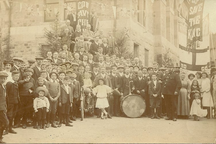 1911 picture, celebrating the coronation of George V outside the old Town Hall in Bovey Tracey.