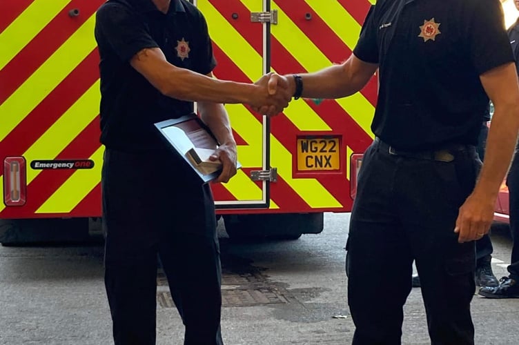 FF Jury being presented with his long service and good conduct medal by SM Dan Searle.jpg