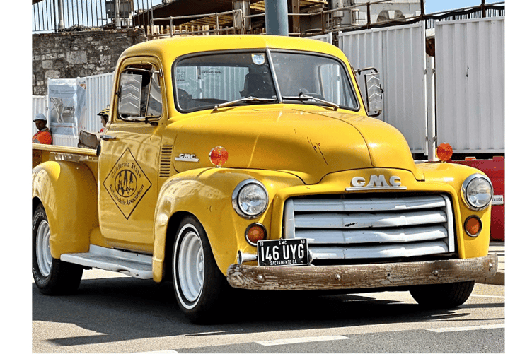 Classic cars drive through Dawlish