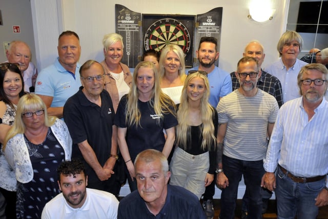 Charity darts team is thrilled to raise £1,000
