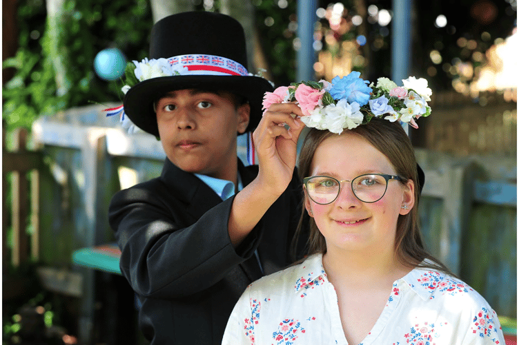 Master of Ceremonies Abhinav crowns the school’s 2023 May Queen Jasmine.